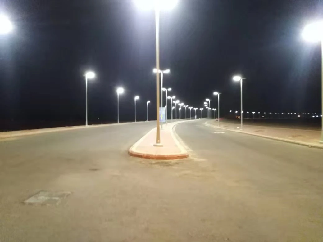 Solar street lights illuminating a roadway at night Solar street lights illuminating a roadway at night